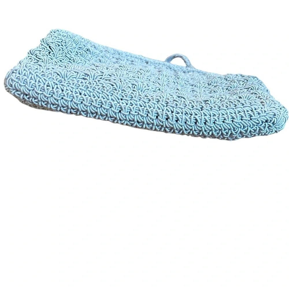 crocheted evening bag with a metal kiss-lock closure and braided shoulder strap